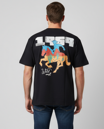 Rear view of a model wearing a black Vie Riche T-shirt with a colorful horse-and-rider graphic