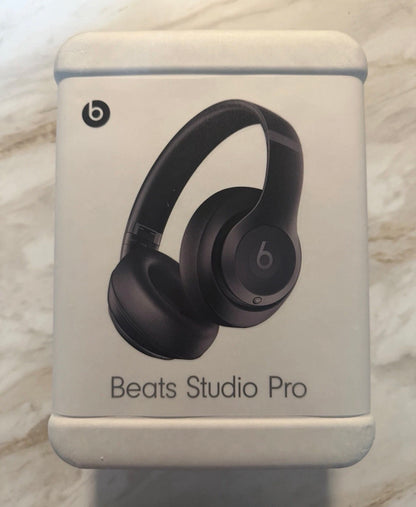 Front of a Beats Studio Pro retail box showing black over-ear headphones
