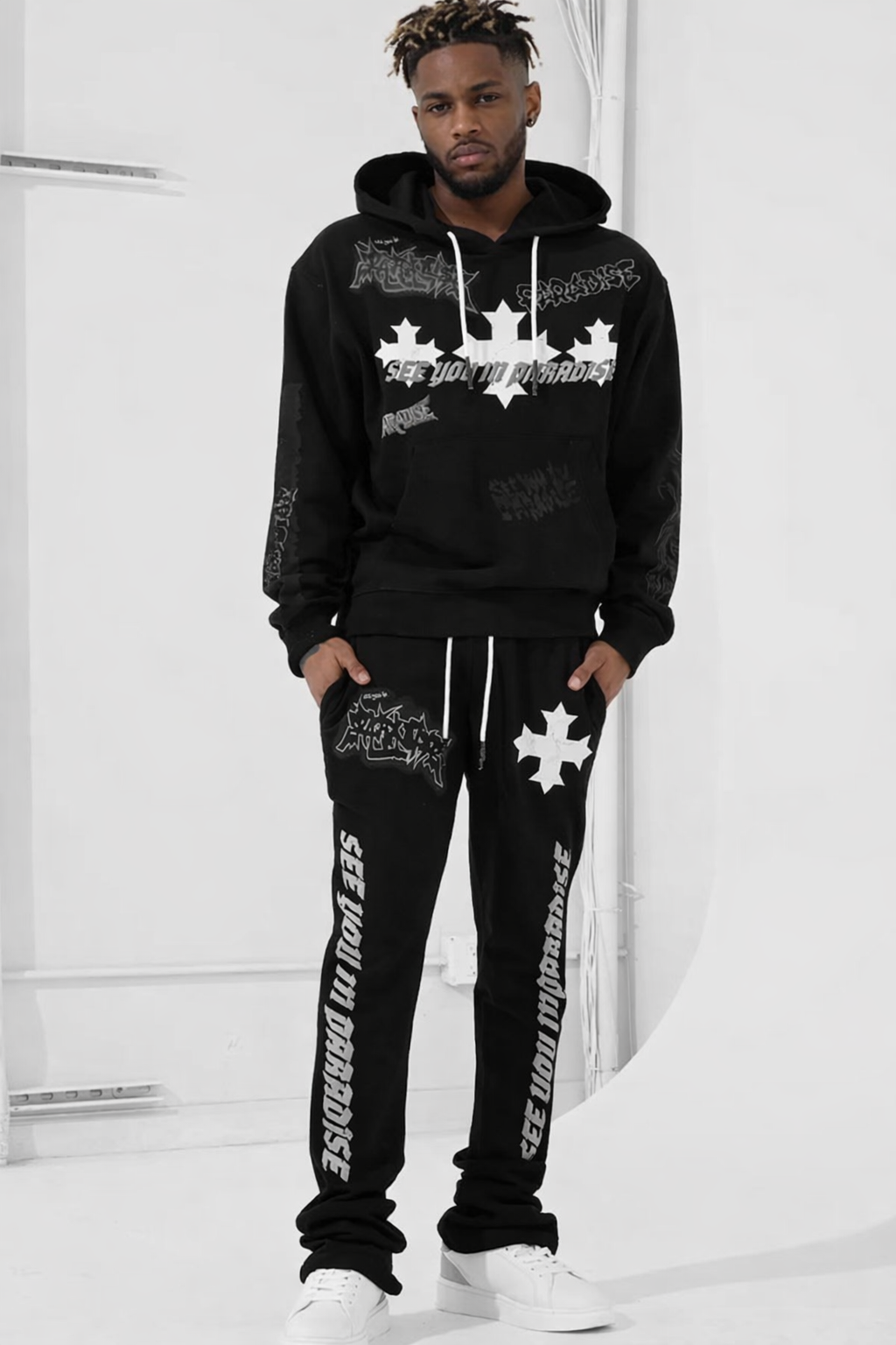 Jordan Craig x See You in Paradise The Reaper Stacked Sweatsuit — black graphic hoodie and stacked pants on model